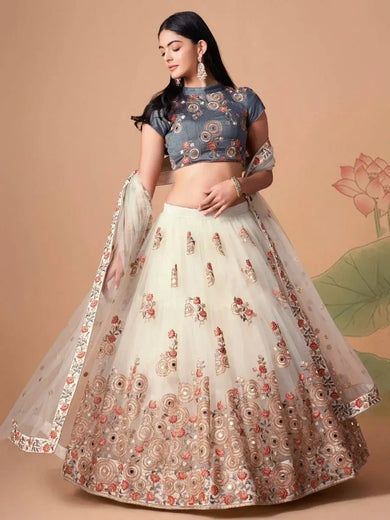 Pretty Ivory Embroidered Net Party Wear Lehenga Choli